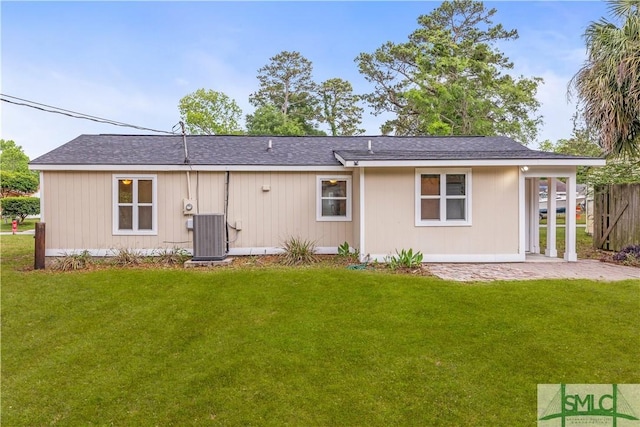 108 Gilliam Ave, Savannah, GA 31406 - back of house with central AC unit and a shingled roof
