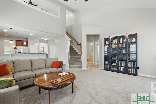 17 Olde Gate Ct, Pooler, GA 31322 - living area featuring a ceiling fan, high vaulted ceiling, light carpet, stairway, and baseboards