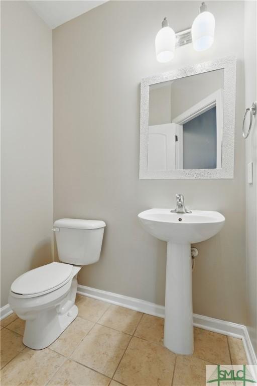 17 Olde Gate Ct, Pooler, GA 31322 - bathroom featuring baseboards, tile patterned flooring, toilet, and a sink