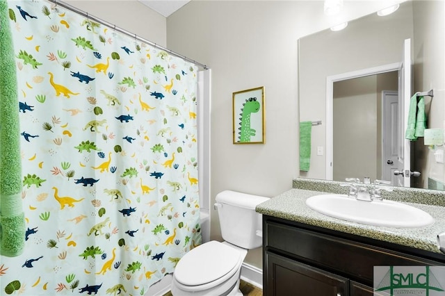 full bathroom with toilet, vanity, and a shower with shower curtain