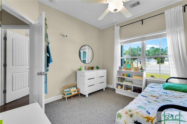 bedroom featuring baseboards, carpet flooring, and a ceiling fan