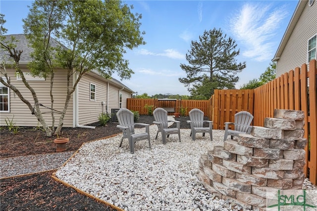 view of patio with a fenced backyard and central AC unit