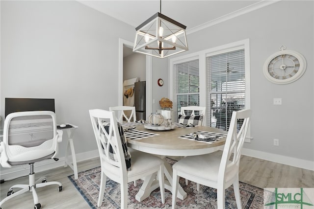 240 Blackjack Oak Dr W, Richmond Hill, GA 31324 - dining room with a chandelier, wood finished floors, and baseboards