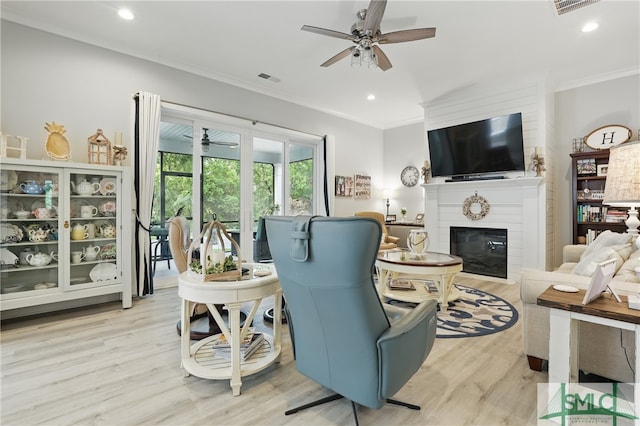 240 Blackjack Oak Dr W, Richmond Hill, GA 31324 - living area featuring crown molding, a ceiling fan, light wood-type flooring, a glass covered fireplace, and recessed lighting