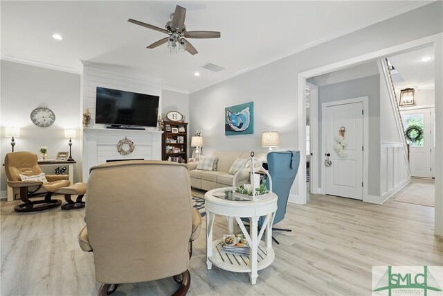 240 Blackjack Oak Dr W, Richmond Hill, GA 31324 - living area featuring ceiling fan, light wood-type flooring, ornamental molding, a large fireplace, and recessed lighting