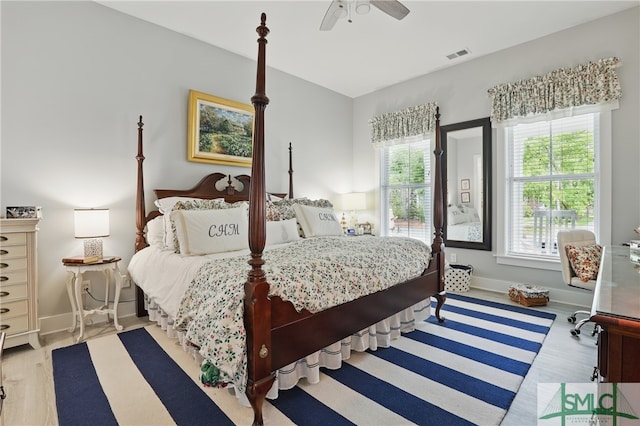 240 Blackjack Oak Dr W, Richmond Hill, GA 31324 - bedroom with wood finished floors, baseboards, and ceiling fan
