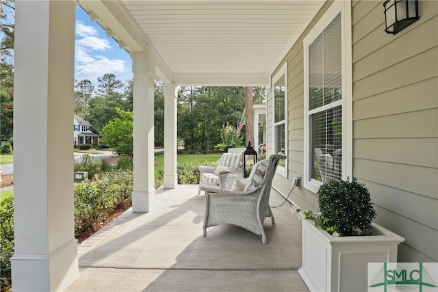 240 Blackjack Oak Dr W, Richmond Hill, GA 31324 - view of patio / terrace featuring covered porch