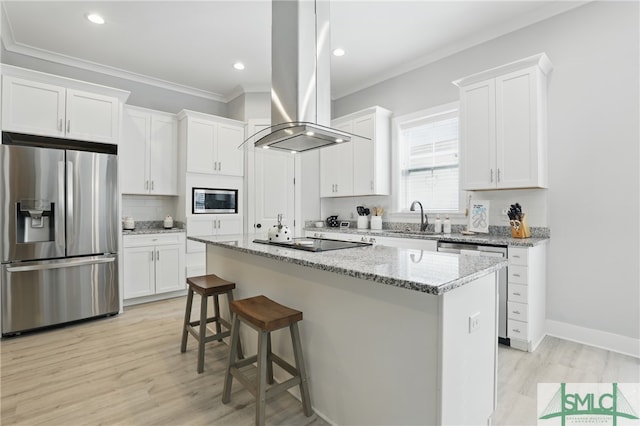240 Blackjack Oak Dr W, Richmond Hill, GA 31324 - kitchen with stainless steel appliances, island range hood, a sink, crown molding, and white cabinets