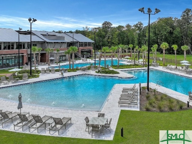240 Blackjack Oak Dr W, Richmond Hill, GA 31324 - community pool featuring a yard and a patio
