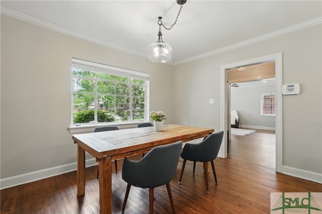 dining room featuring baseboards, crown molding, plenty of natural light, and dark wood-style flooring