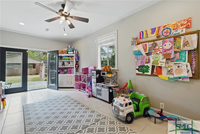 recreation room with tile patterned flooring, ornamental molding, ceiling fan, and recessed lighting