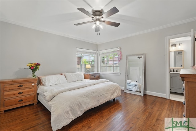 bedroom with ornamental molding, wood finished floors, baseboards, a ceiling fan, and ensuite bathroom
