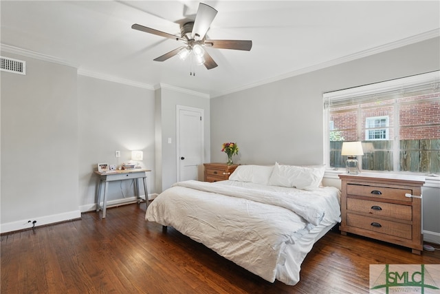 bedroom featuring dark wood-type flooring, ornamental molding, baseboards, and ceiling fan