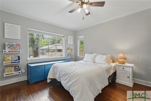 bedroom featuring dark wood-style floors, baseboards, ornamental molding, and a ceiling fan