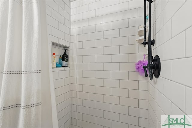 full bathroom with a tile shower