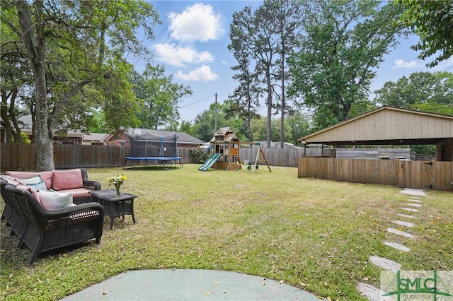view of yard featuring a trampoline, a playground, and outdoor lounge area