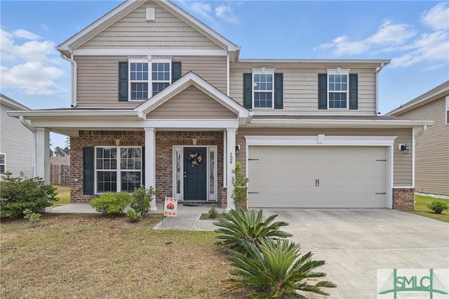 view of front of home with a garage, concrete driveway, and brick siding