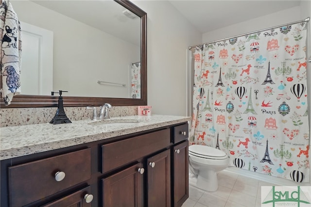 bathroom featuring tile patterned floors, toilet, vanity, and curtained shower