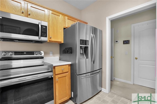 113 Taylor Ct, Richmond Hill, GA 31324 - kitchen featuring stainless steel appliances, light countertops, and baseboards