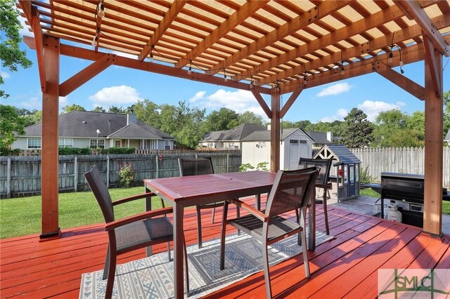 113 Taylor Ct, Richmond Hill, GA 31324 - wooden terrace with a shed, outdoor dining space, a residential view, an outdoor structure, and a pergola