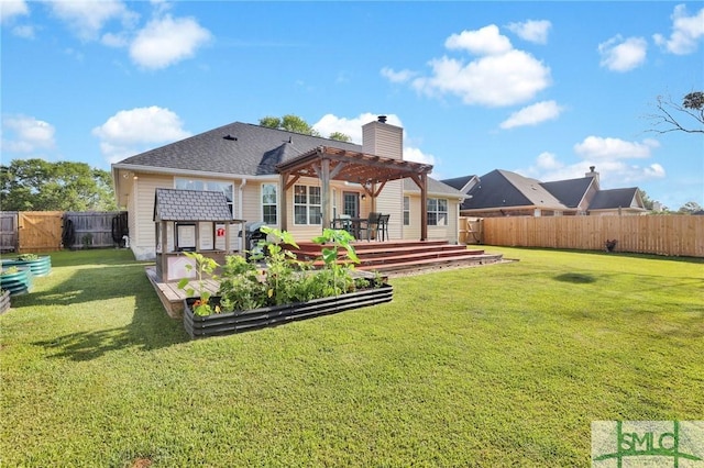113 Taylor Ct, Richmond Hill, GA 31324 - rear view of house with a vegetable garden, a pergola, a chimney, and a deck
