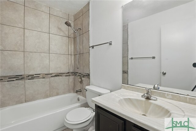57 Cut Off Way, Richmond Hill, GA 31324 - bathroom featuring toilet, vanity, and bathing tub / shower combination
