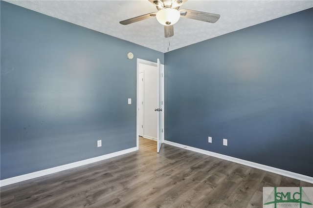 57 Cut Off Way, Richmond Hill, GA 31324 - empty room with baseboards, a ceiling fan, wood finished floors, and a textured ceiling