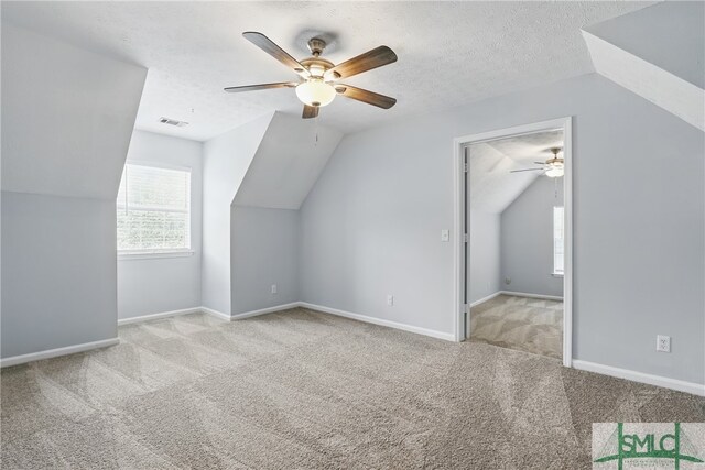 57 Cut Off Way, Richmond Hill, GA 31324 - bonus room featuring ceiling fan, carpet floors, vaulted ceiling, baseboards, and a textured ceiling