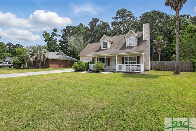 57 Cut Off Way, Richmond Hill, GA 31324 - view of front of home with concrete driveway, covered porch, a chimney, and a shingled roof