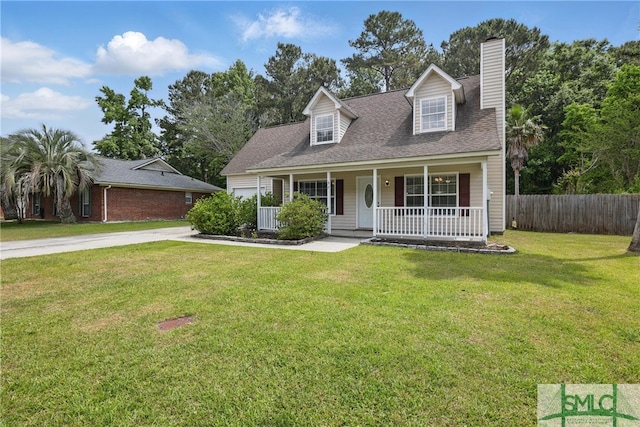 57 Cut Off Way, Richmond Hill, GA 31324 - cape cod-style house featuring a porch, a chimney, and concrete driveway