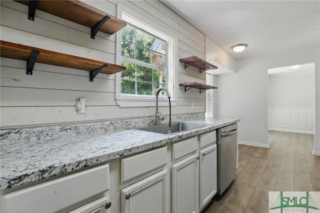 57 Cut Off Way, Richmond Hill, GA 31324 - kitchen with open shelves, dishwasher, a sink, wood finished floors, and light stone countertops