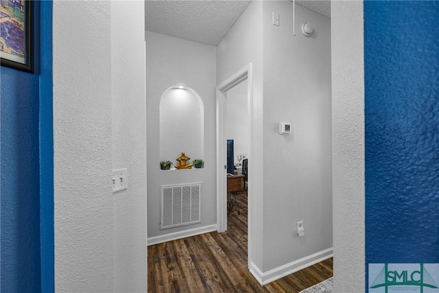 38 Travertine Cir, Savannah, GA 31419 - hall featuring wood finished floors, a textured ceiling, baseboards, and a textured wall