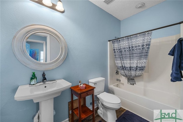 38 Travertine Cir, Savannah, GA 31419 - full bathroom featuring a textured ceiling, toilet, bathing tub / shower combination, and wood finished floors