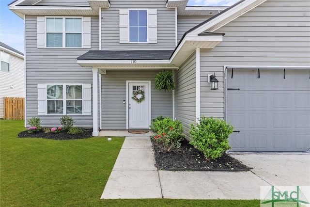 110 Richmond Pass Cir, Midway, GA 31320 - property entrance with an attached garage