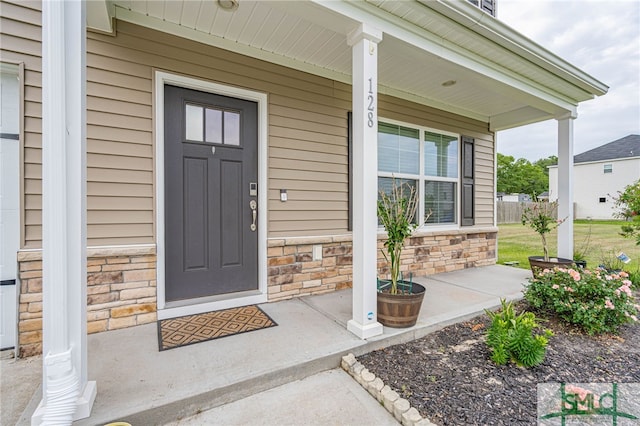 128 Greenbriar Dr, Guyton, GA 31312 - entrance to property featuring covered porch and stone siding