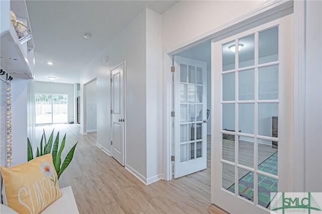 128 Greenbriar Dr, Guyton, GA 31312 - corridor featuring wood finished floors, baseboards, and french doors