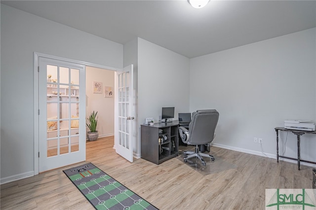 128 Greenbriar Dr, Guyton, GA 31312 - home office featuring french doors, wood finished floors, and baseboards