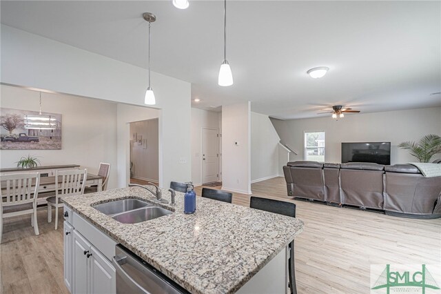 128 Greenbriar Dr, Guyton, GA 31312 - kitchen featuring dishwasher, a sink, light wood finished floors, open floor plan, and ceiling fan