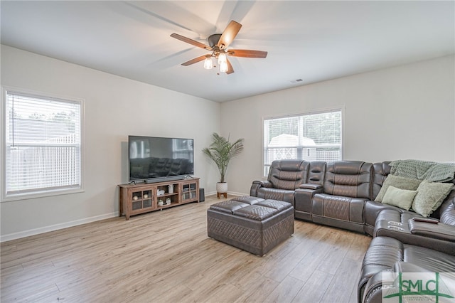 128 Greenbriar Dr, Guyton, GA 31312 - living room featuring light wood-style flooring, ceiling fan, and baseboards