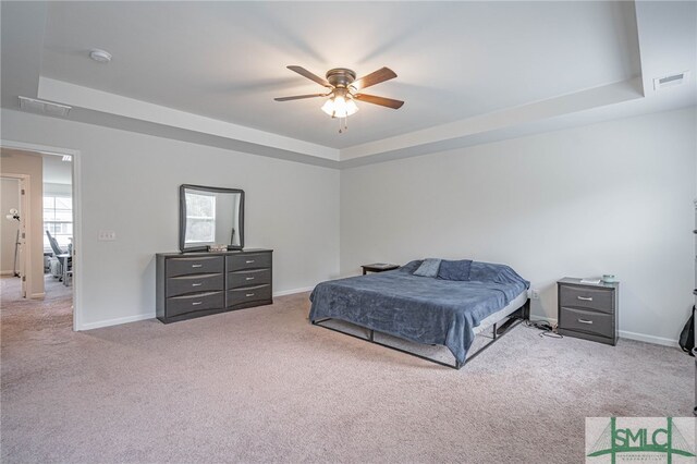 128 Greenbriar Dr, Guyton, GA 31312 - bedroom featuring a raised ceiling, carpet, and baseboards