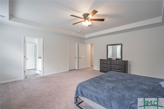 128 Greenbriar Dr, Guyton, GA 31312 - bedroom with a raised ceiling, baseboards, carpet, and a ceiling fan