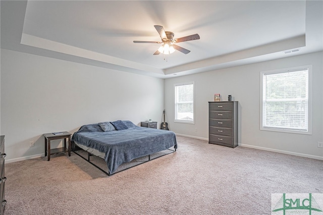 128 Greenbriar Dr, Guyton, GA 31312 - bedroom featuring a raised ceiling, light colored carpet, baseboards, and ceiling fan