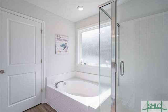 128 Greenbriar Dr, Guyton, GA 31312 - full bathroom with a shower stall, a garden tub, and wood finished floors
