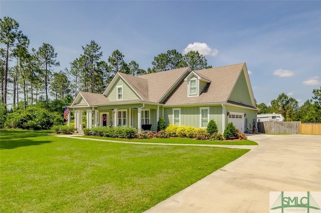 201 Cumberland Pt, Statesboro, GA 30458 - view of front of house with board and batten siding, driveway, a porch, and a garage