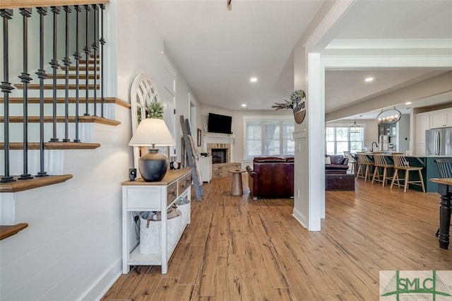 201 Cumberland Pt, Statesboro, GA 30458 - living area featuring light wood-style floors, a fireplace, recessed lighting, and stairway