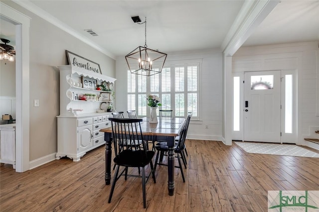 201 Cumberland Pt, Statesboro, GA 30458 - dining space with a chandelier, light wood-style flooring, and crown molding