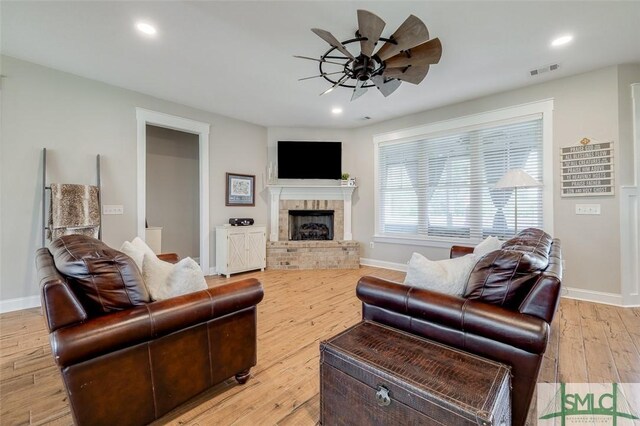 201 Cumberland Pt, Statesboro, GA 30458 - living area featuring a ceiling fan, baseboards, a brick fireplace, light wood-style floors, and recessed lighting