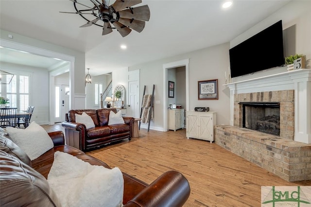 201 Cumberland Pt, Statesboro, GA 30458 - living area with ceiling fan, light wood-type flooring, recessed lighting, a brick fireplace, and baseboards