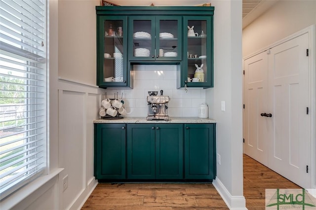 201 Cumberland Pt, Statesboro, GA 30458 - indoor bar featuring light wood-style floors, healthy amount of natural light, and backsplash