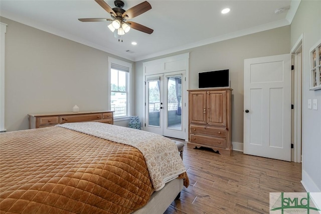 201 Cumberland Pt, Statesboro, GA 30458 - bedroom featuring access to exterior, french doors, light wood-style flooring, crown molding, and baseboards